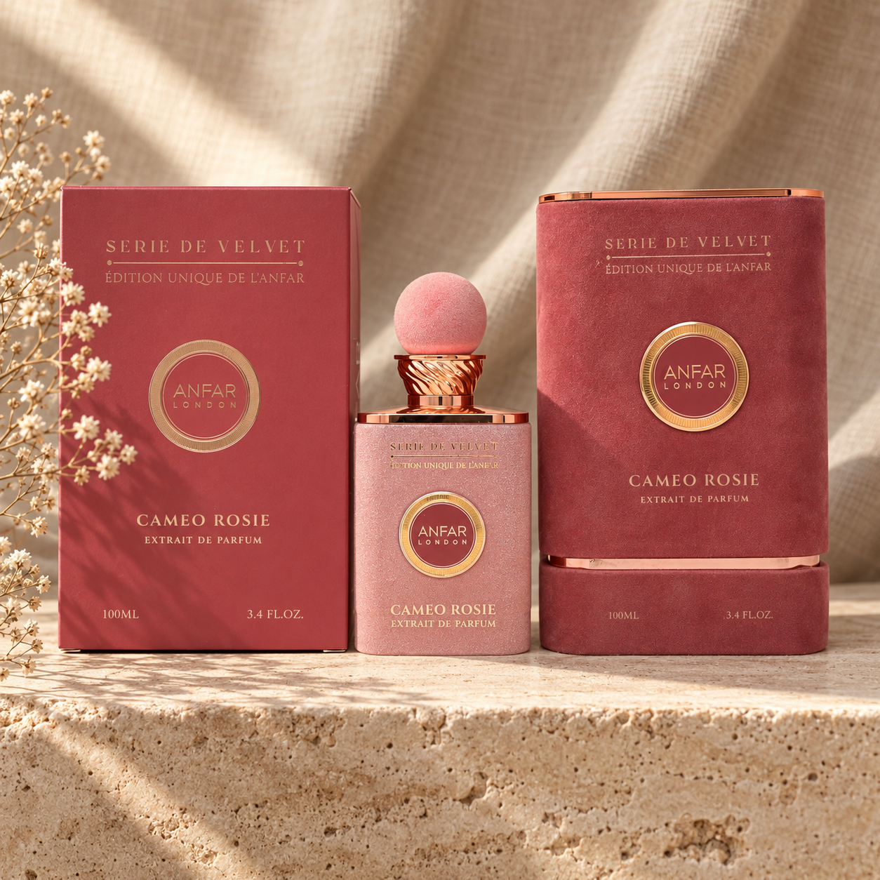 Anfar London Cameo Rosie Extrait de Parfum 100 ml blush pink bottle and dusty rose box on a travertine ledge with linen backdrop
