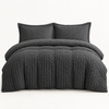 Seersucker Textured Duvet Cover Set in dark grey layered on a made bed