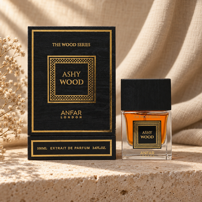 Anfar London Ashy Wood Extrait de Parfum 100 ml bottle and black wood gold lattice box on a travertine ledge with linen backdrop