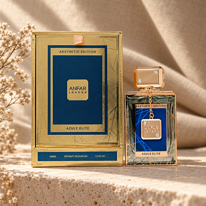 Anfar London Azule Elite Extrait de Parfum 100 ml bottle and mirror gold and petrol blue box on a travertine ledge with linen backdrop