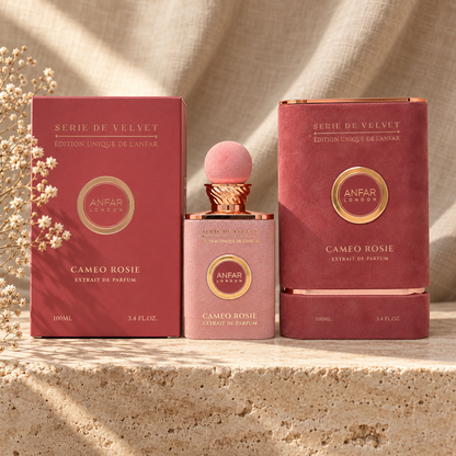 Anfar London Cameo Rosie Extrait de Parfum 100 ml blush pink bottle and dusty rose box on a travertine ledge with linen backdrop