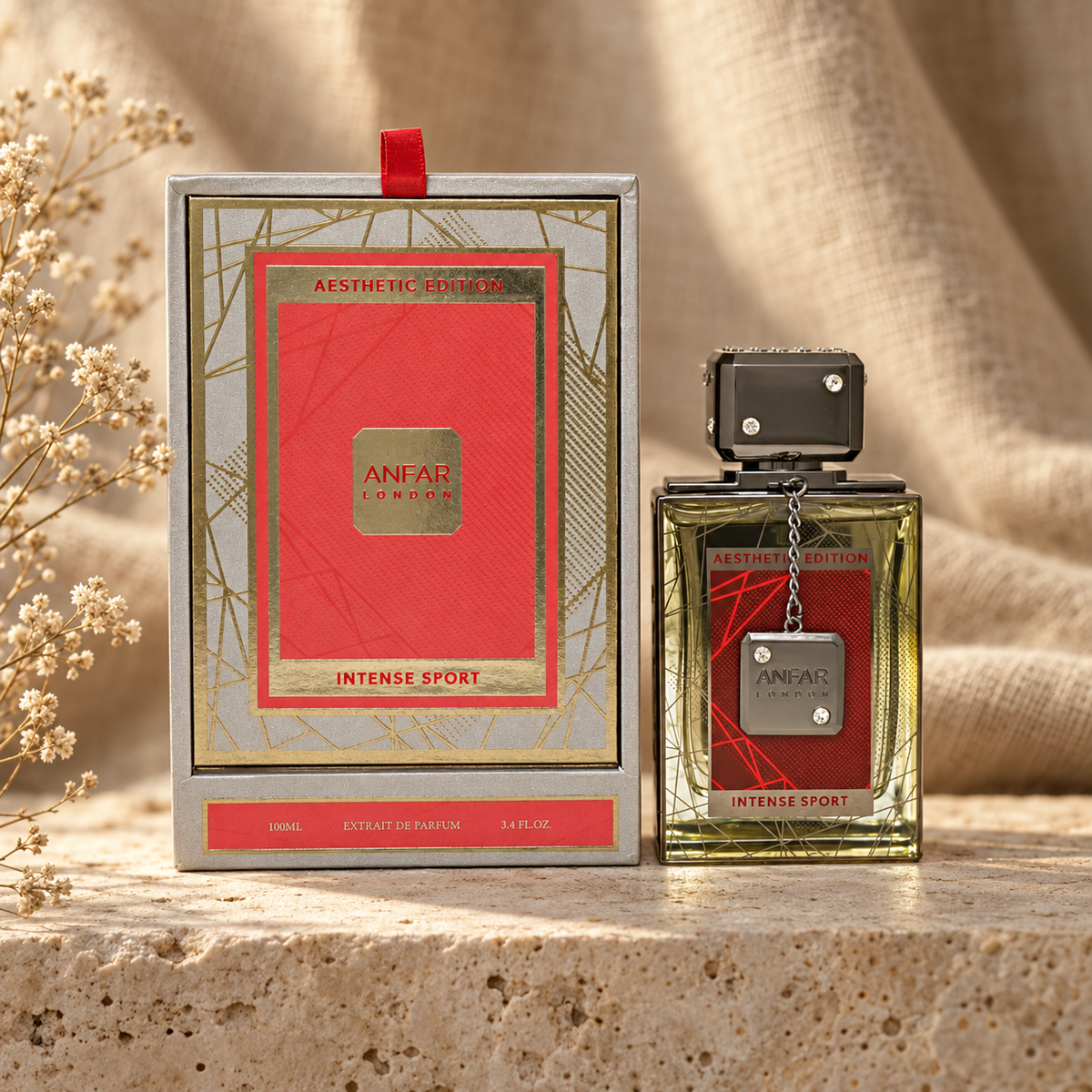 Anfar London Intense Sport Extrait de Parfum 100 ml bottle and silver and coral red box on a travertine ledge with linen backdrop