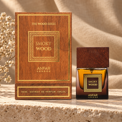 Anfar London Smoky Wood Extrait de Parfum 100 ml bottle and mahogany wood box on a travertine ledge with linen backdrop