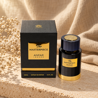 Anfar London The Masterpiece Extrait de Parfum 100 ml bottle and charcoal black gold plaque box on a travertine ledge with linen backdrop